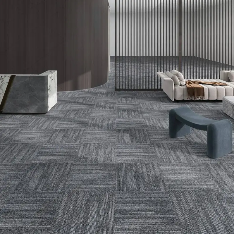 Grey commercial carpet tiles in modern office lobby
