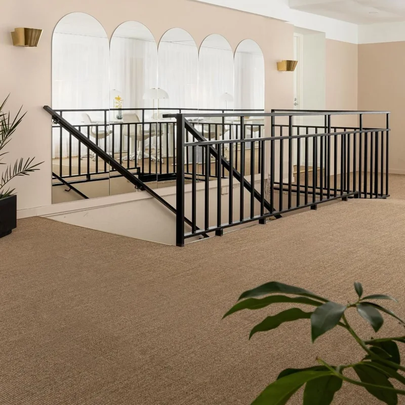 Light brown flatweave Luxury carpet in open hallway