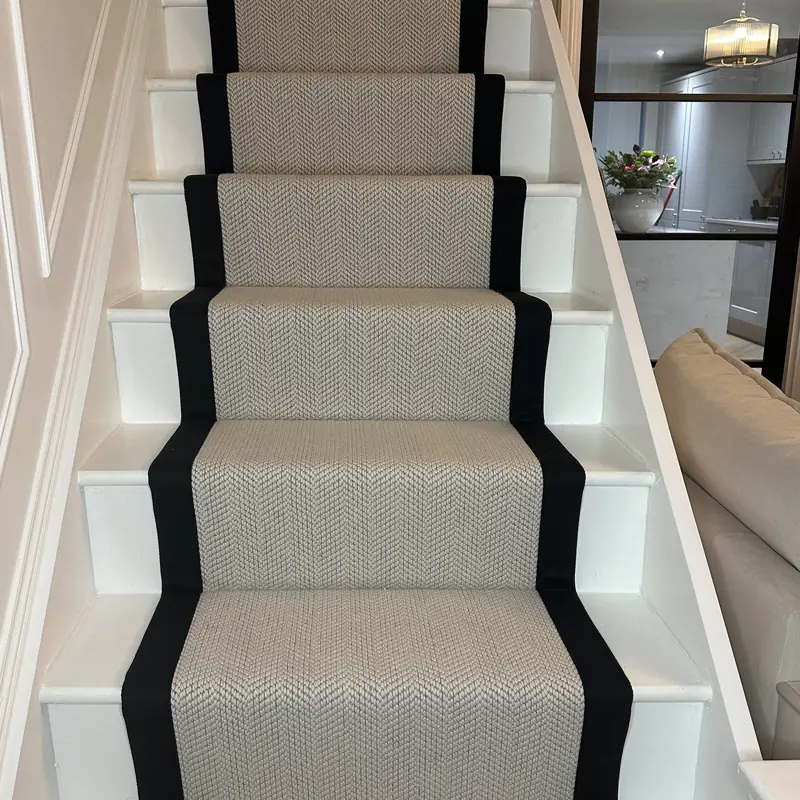 Patterned stair runner carpet with black border